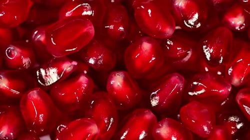 A close up of pomegranate fruit seeds