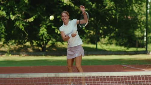 Happy Young Woman Playing Tennis Outdoor Court at Sunlight Tennis Ball Active Adult Sportswoman