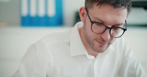 Confident Young Businessman Wearing Eyeglasses
