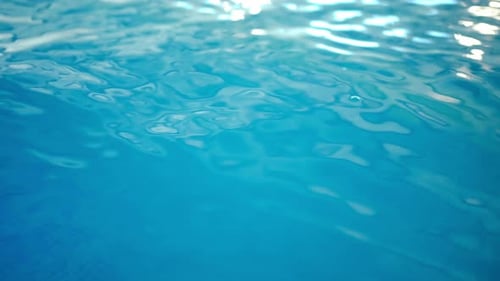 Bright Blue Water Ripples and Reflects Light