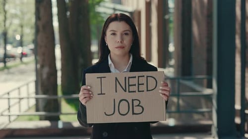 Caucasian Businesswoman Holding Poster Cardboard with Need Job Jobless Message Crisis Text Job