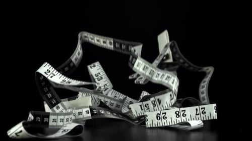 The Measuring Ruler for Sewing Falls on the Table Filmed on a Highspeed Camera at 1000 Fps
