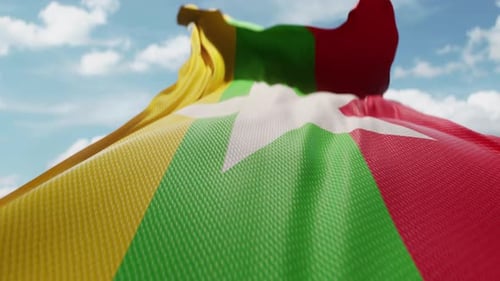 Detailed Myanmar National Flag Waving Against Blue Sky