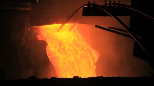 Molten Metal Pouring Out Of Furnace. Liquid Metal From Blast Furnace. Molten Metal Foundry. Pouri...