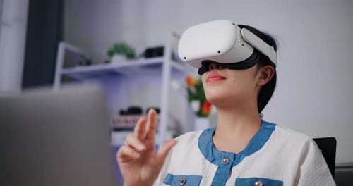 Young Adult Woman with VR Headset Interacting
