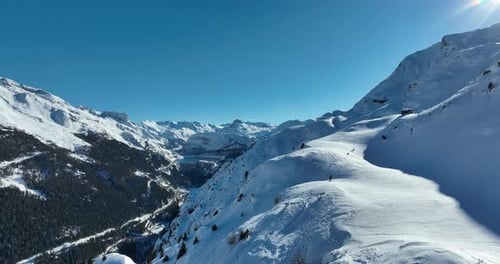 Aerial View of Snow-Covered Mountains on Sunny Day