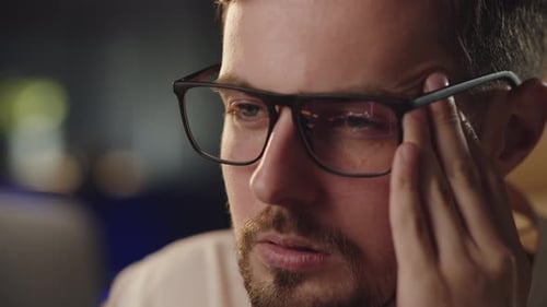 Businessman Analyzing Stock Market Eyeglasses Reflection of Trading Platform Thoughtful Investor Guy