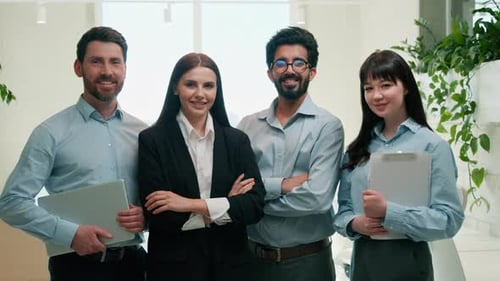 Happy Multiethnic Business Team Posing Corporate Portrait in Office Smiling Looking at Camera