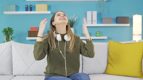 Woman Dances to Music at Home