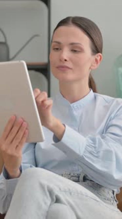 Woman Using a Tablet in her Home
