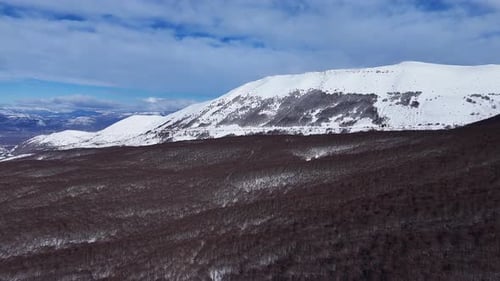 Drone Aerial Video Flying Forward Towards Snowy Mountain and Forest in Abruzzo Italy