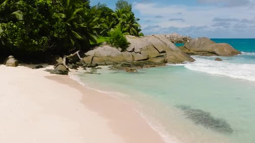 Serene Tropical Coastline with Turquoise Waters and Rocky Formations Seychelles Mahe