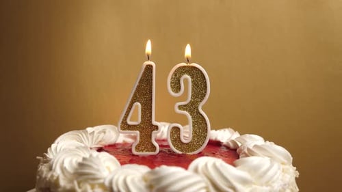 43. They blow out a candle in the form of the number 43, which is stuck into the holiday cake. Celeb