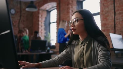Chinese Female Office Worker Portrait At Workplace In Office Woman Working With Computer