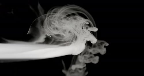 White Smoke Drifting Slowly on Black Background