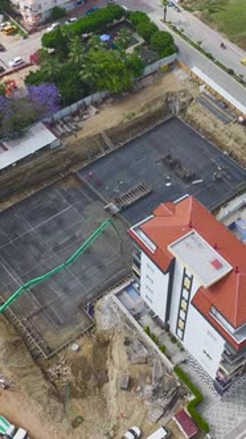 Aerial View of Building Construction in Urban Setting