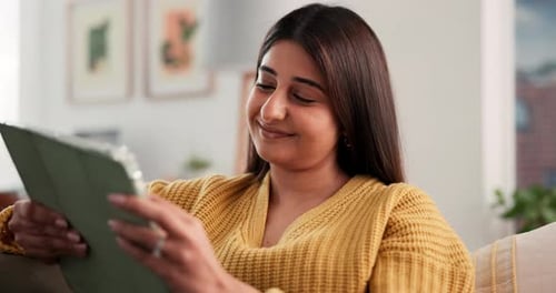 Woman Using a Tablet Indoors in a Bright Home