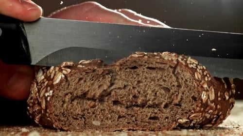 Close-up of Slicing Whole Grain Bread