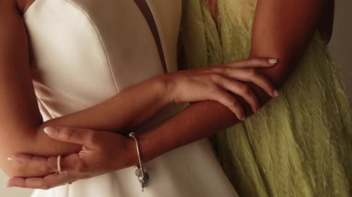 Bride Embraced by Friend on Her Wedding Day