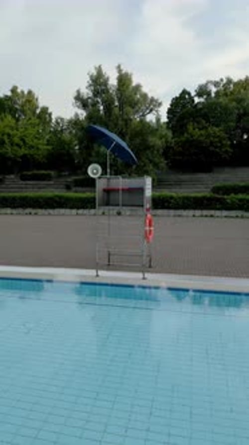 Aerial view of serene public pool surrounded by trees, Germany.