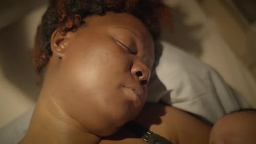 Mother and Infant Sleeping Peacefully Together