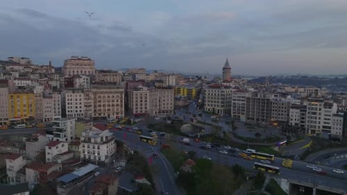 Aerial View of Heavy Traffic on Busy Thoroughfare in Urban Borough at Dusk Historic Galata Tower in