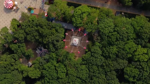 A Carousel in an Amusement Park Circling in a Circle
