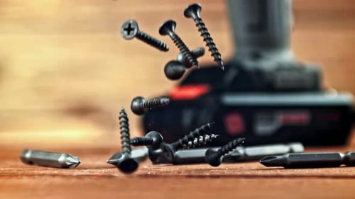 Super Slow Motion Selftapping Screws Fall on the Table