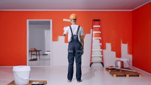 Full Body Of Back View Asian Man Painter Painting With Painting Wall In Room