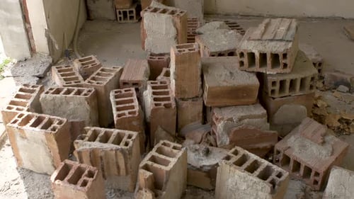 Piles of bricks in unfinished building in Sofia, Bulgaria showing halted construction progress