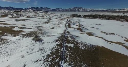 A flight over a snow covered valley
