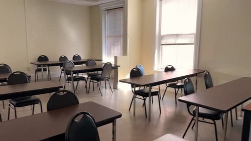 Empty Classroom with Desks and Chairs for Learning