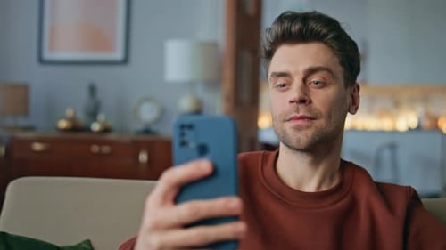 Businessman Greeting Video Call By Smartphone Sitting Home Close Up Man Swiping