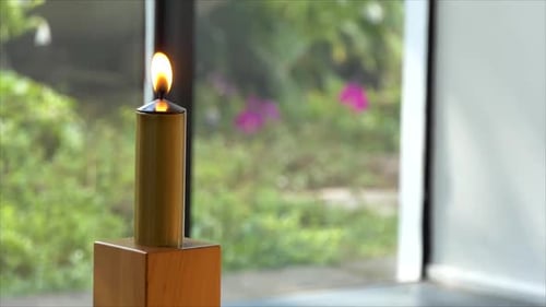Shot of lighted candles used for prayers in memorial wedding funeral services in a religious church