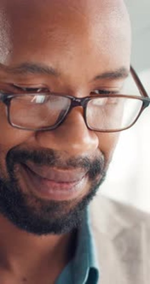 Glasses, business and black man in office for reading, smile or investment chart with tech