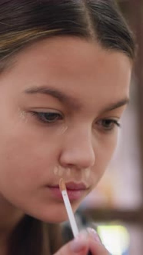 Teen Girl Applying Makeup with Brush Close Up