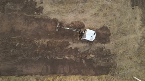 Earth Moving Tractor Preparing Place for Future House Foundation Construction