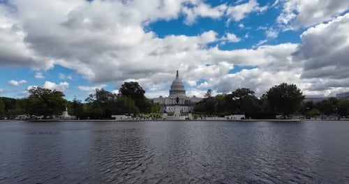 Capitol Building showing from the pool in front of it and its reflection in Washington DC in the USA