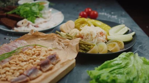 Several Plates of Pickles and Appetizers are on the Table Restaurant Food