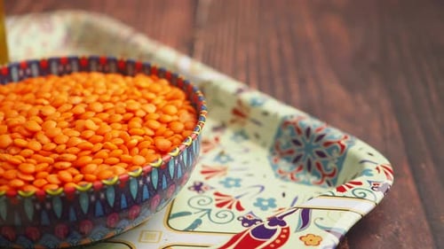 Colorful Bowl of Red Lentils on Patterned Tray
