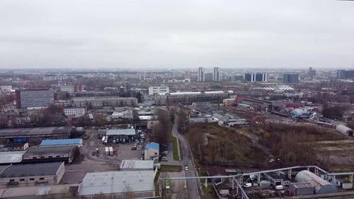 Medium Aerial of Riga Port with Cranes and Containers