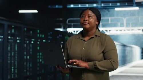 Software Developer Automates Data Center Operations with Laptop Computer in Data Center