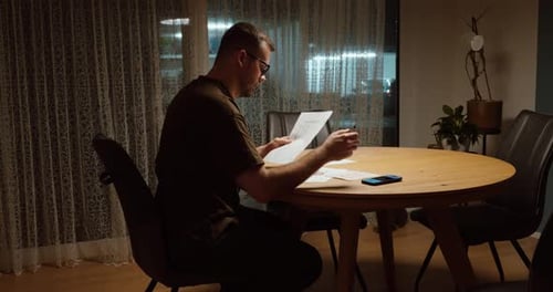 Man Worried About Mortgage Payments at Home