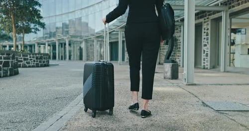 Back, suitcase and a business woman walking to the airport for international travel or a work trip