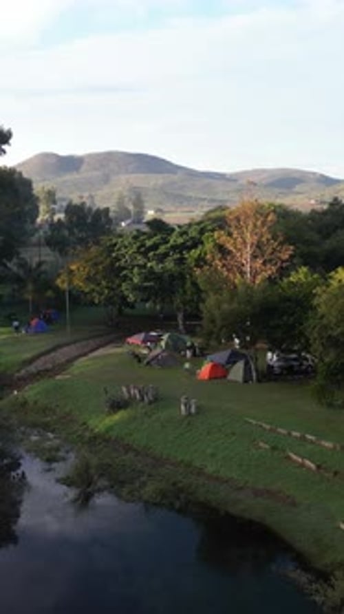 Drone, tent and camping in nature, vacation and environment with landscape