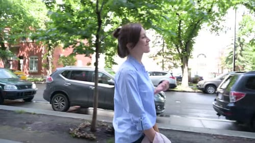 Smiling Businesswoman Walking on Urban Sidewalk 3539 Years