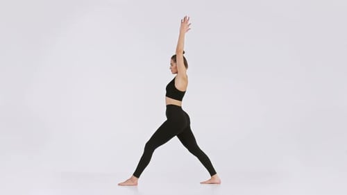 Woman Practicing Yoga Poses in an Elegant Minimalistic Studio Setting