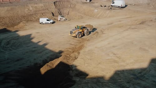 Construction Site Aerial View with Yellow Bulldozer