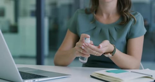 Woman, office and sanitize hands to disinfect, laptop and hygiene for germs, virus and disease