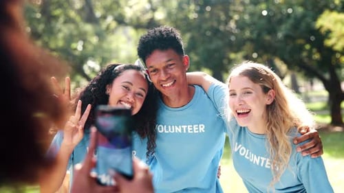 Happy Volunteers Posing for Picture in Sunny Park